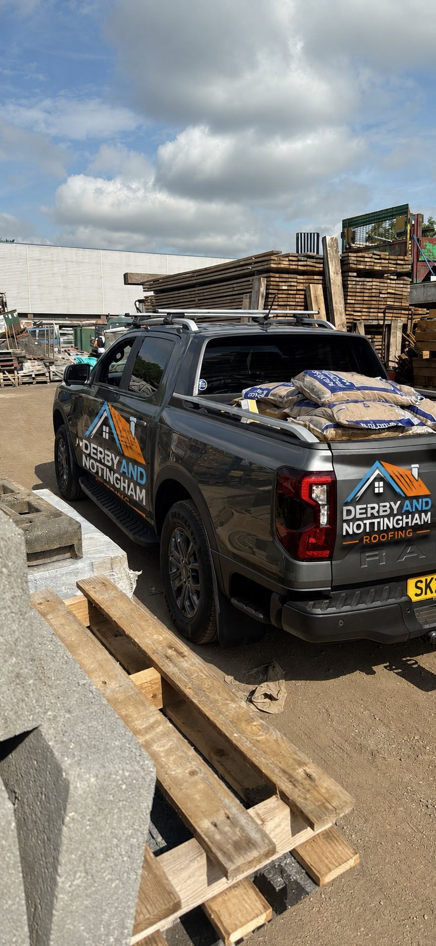 Derby & Nottingham Roofing van loaded with materials
